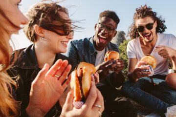burger dining with friend stock